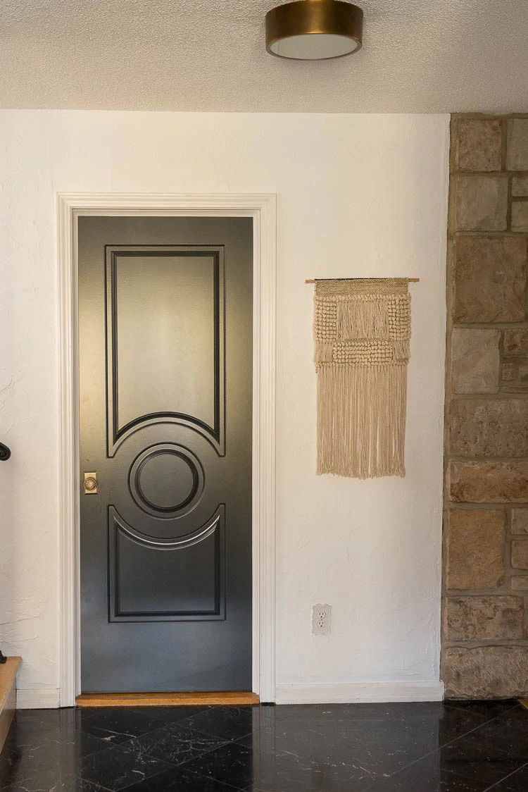 Brass flush mount in entryway 