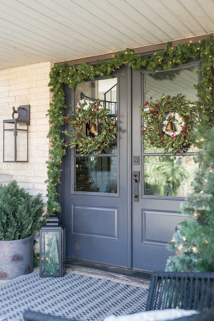 Front porch with double front doors decorated for Christmas