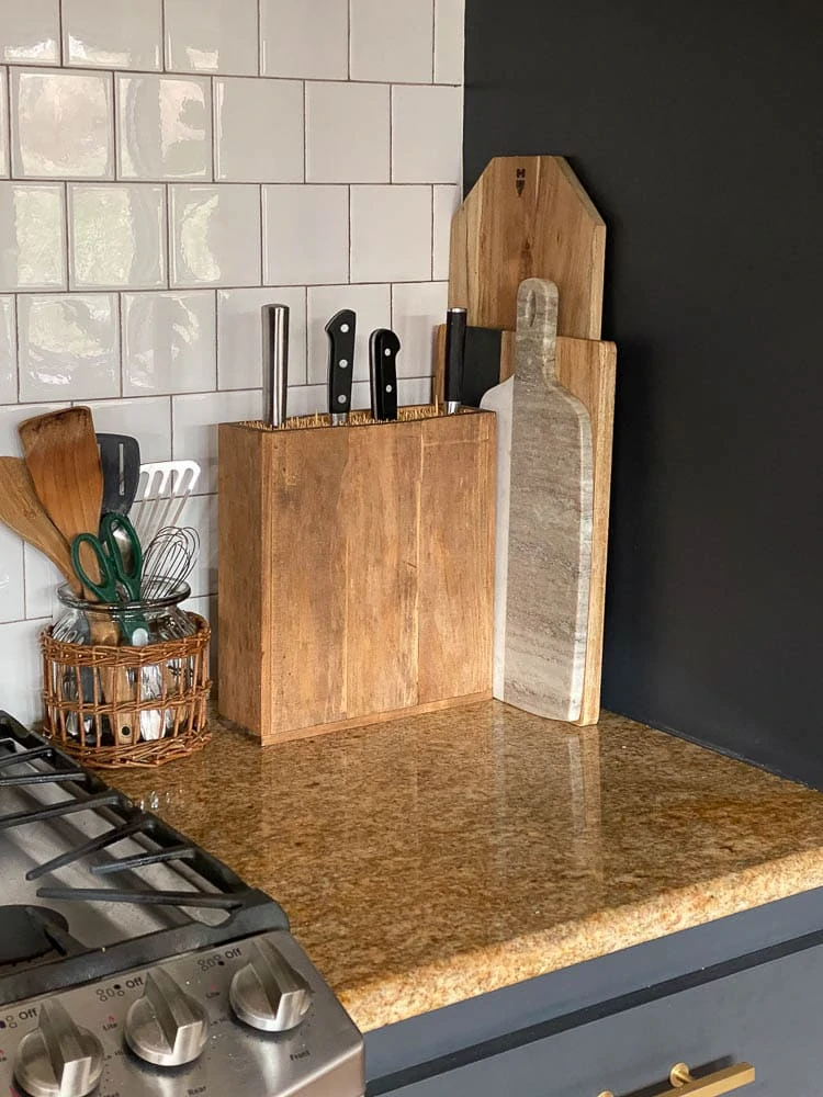 DIY knife holder sitting on a kitchen counter by the stove. A great option for knife storage!