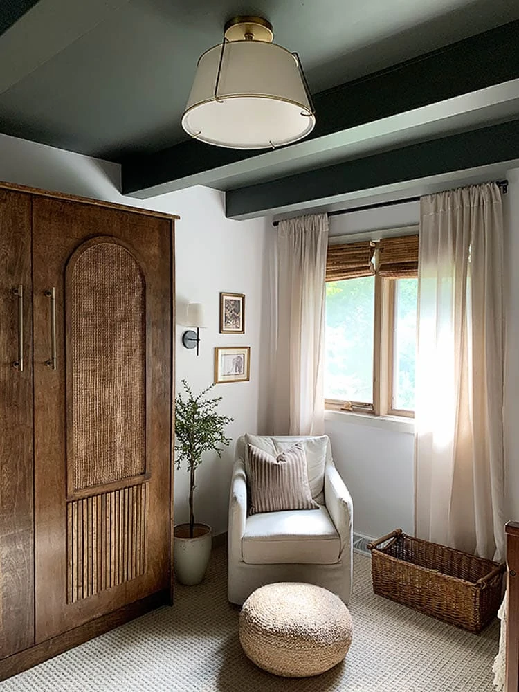 Nursery with wood Murphy bed and green ceiling