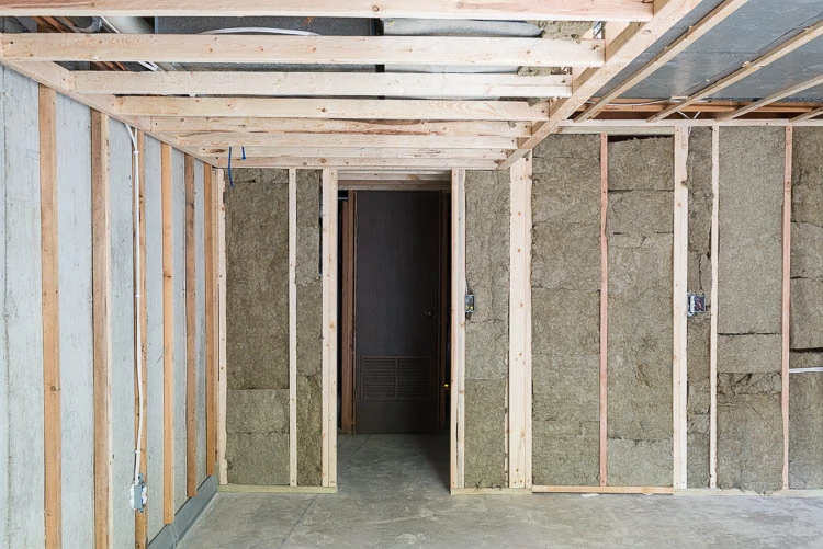 Rockwool safe 'n' sound wool insulation with sound dampening product in basement