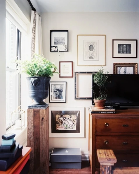 Gallery wall behind tv. Eclectic gallery wall floating behind tv.