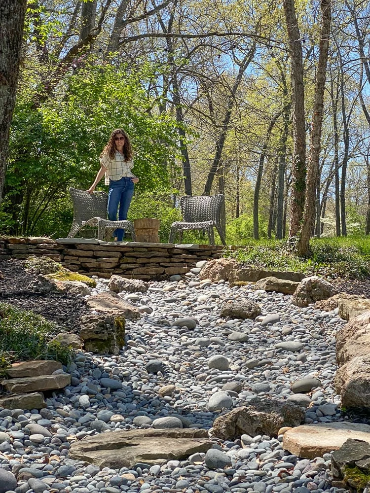 Rock Creek with patio on top and rocks around trees 