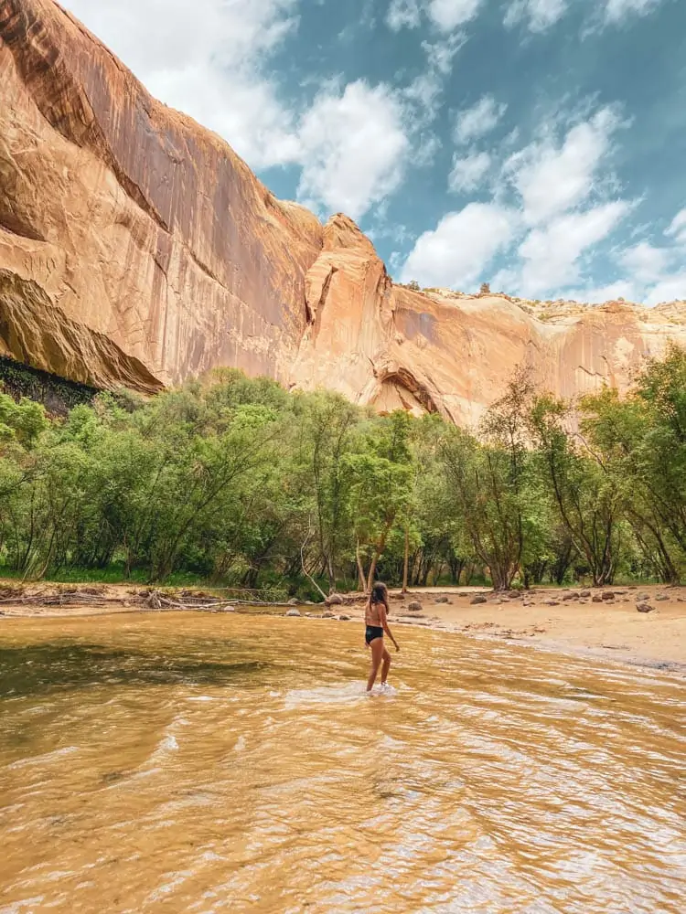 Swimming in Calf Creek Falls Utah after hiking the Lower Calf Creek Falls trail. 