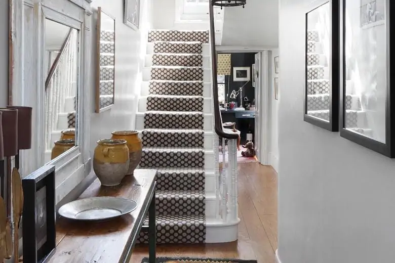 modern rug on stairs in a classic traditional home 