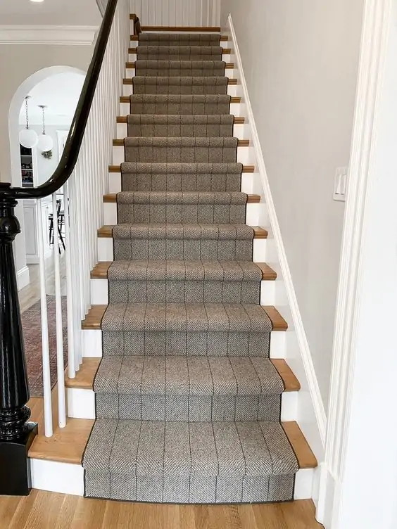 https://biggerthanthethreeofus.com/wp-content/uploads/2022/10/Striped-rug-on-stairs.webp