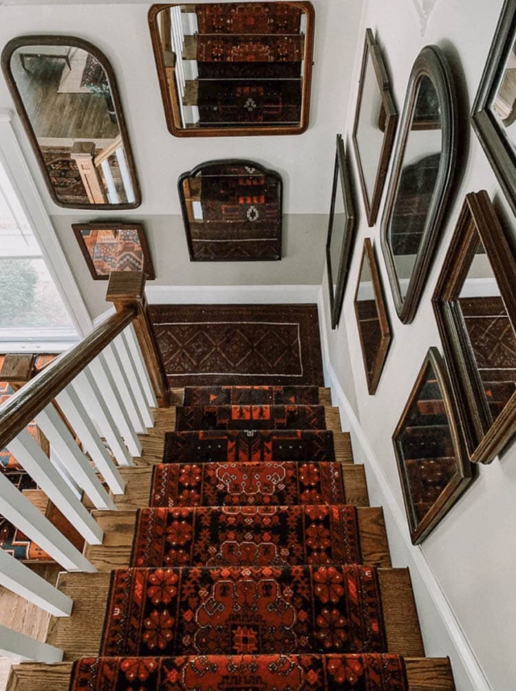 Persian antique rugs combined on stairs to make one long stair carpet runner 