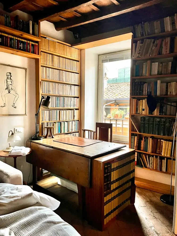 two bedroom rental in Trastevere, Rome, Italy filled with books and antiques 