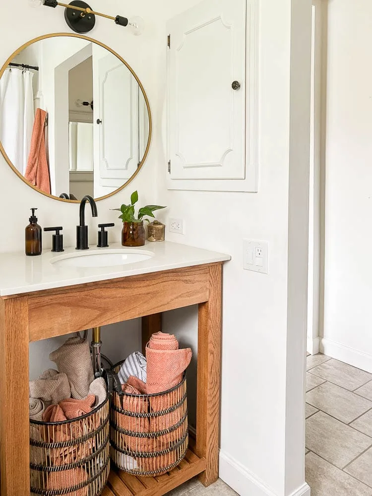 Black bathroom faucet on single sink in bathroom