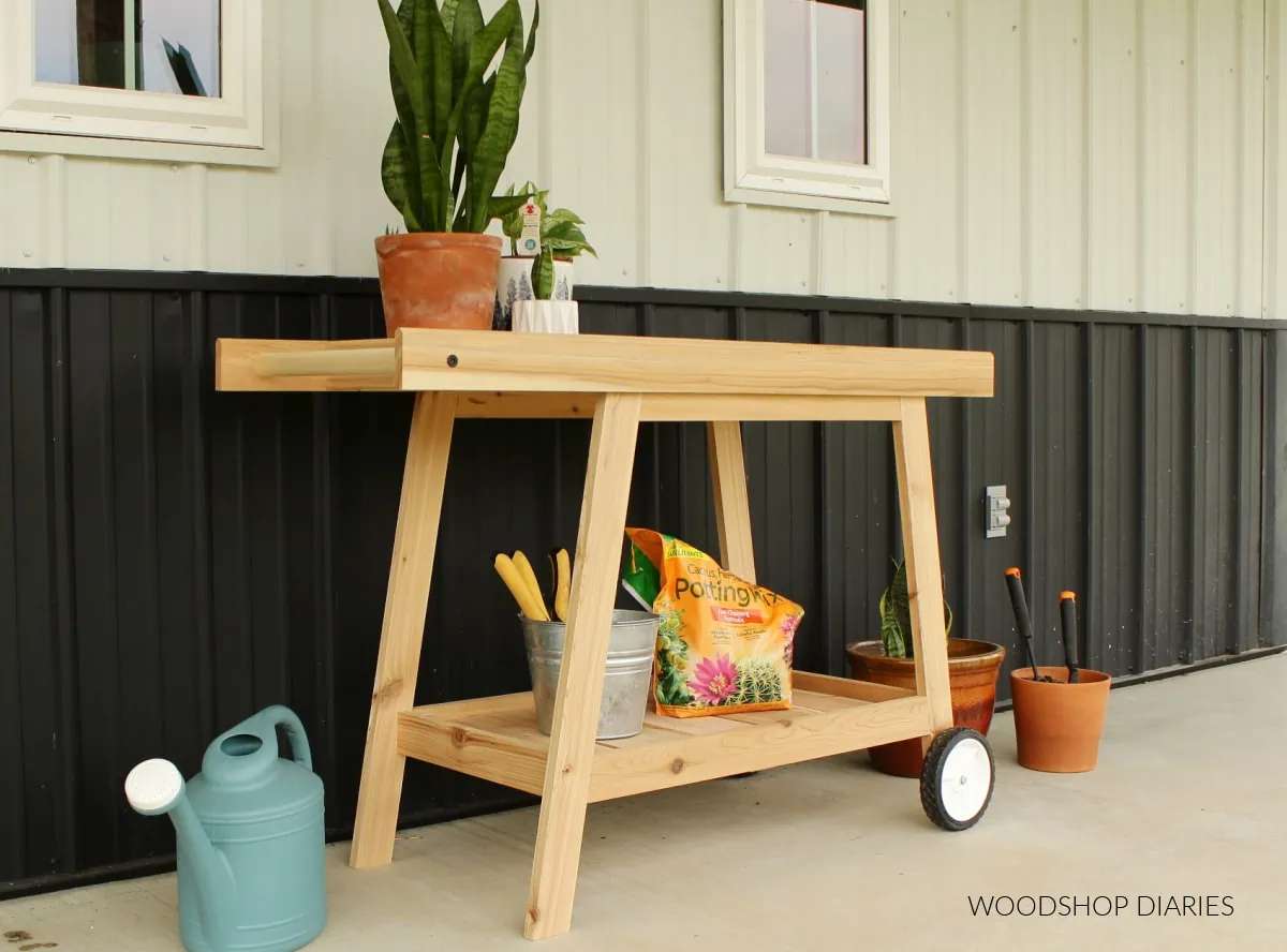 This DIY potting bench with wheels makes the best garden cart!