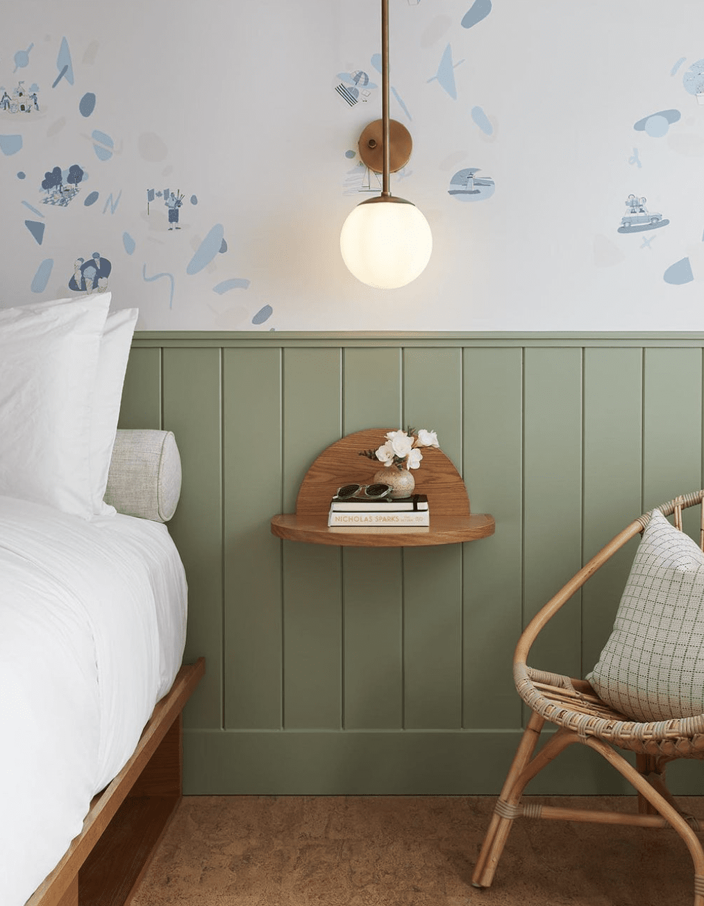 Green shiplap half wall with wallpaper in bedroom 