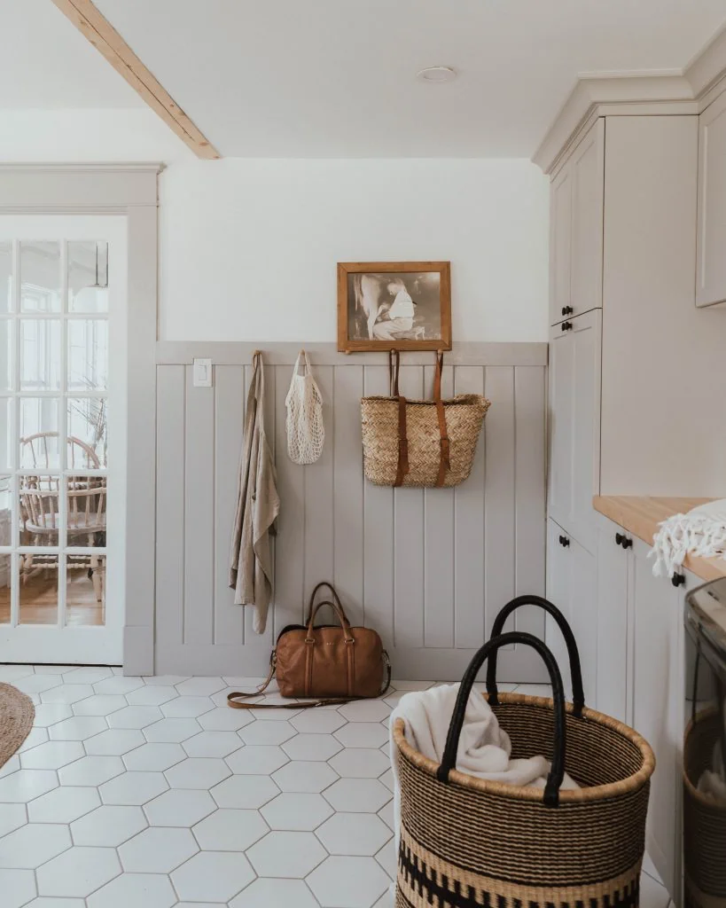 shiplap wainscoting in mudroom with shaker pegs