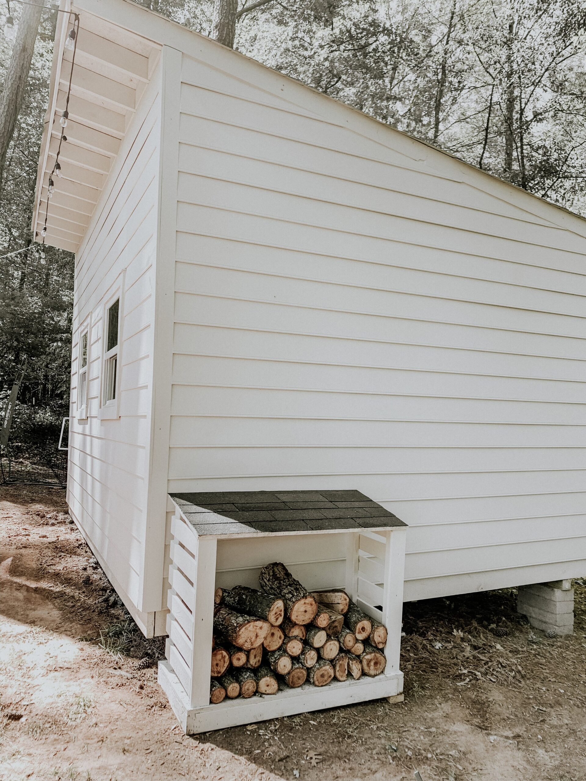 a covered wood firewood box DIY with shingles