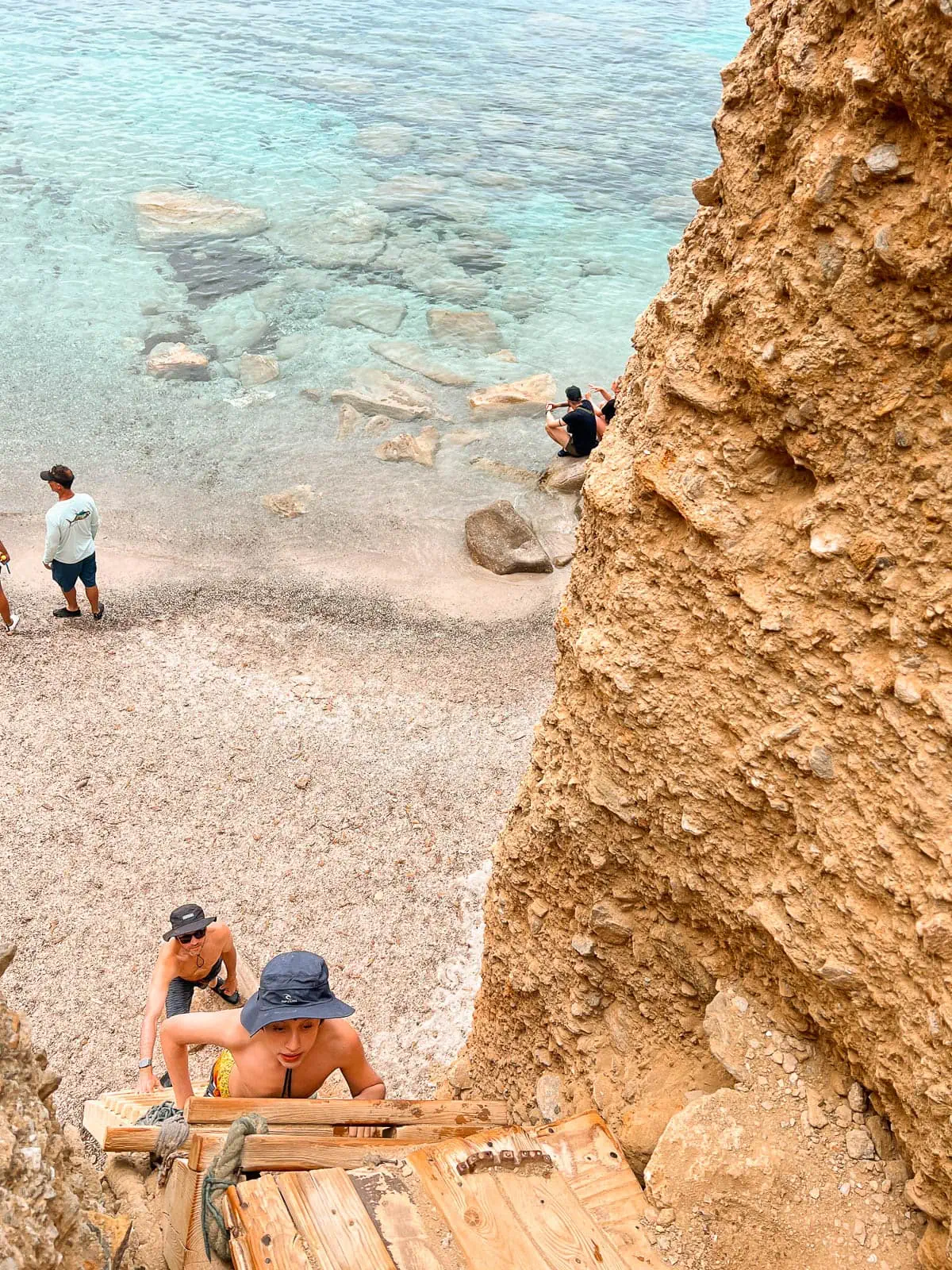 Navigating the ladders at Tsigrado Beach