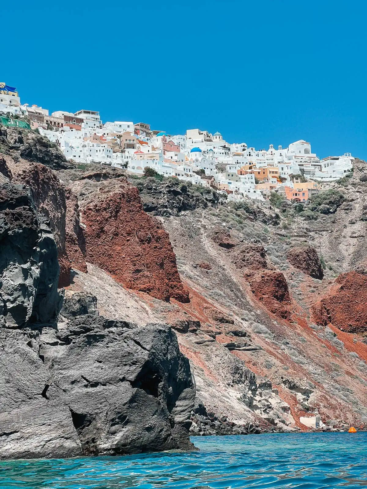 Cliff jumping near Amoudi Bay and viewing Oia Santorini from the water. 