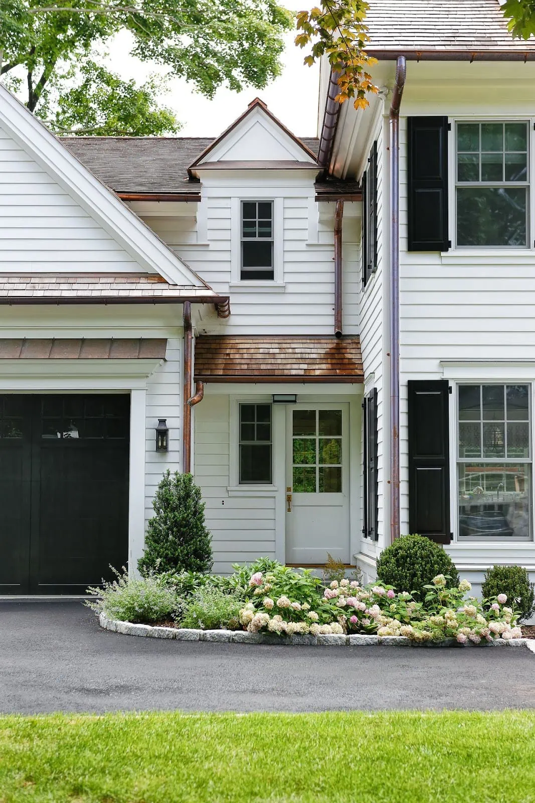 copper gutters and shake roof exterior 