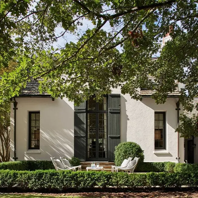 white stucco exterior with black trim 