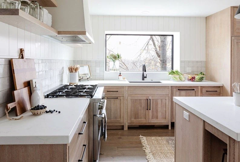 wood kitchen with white shiplap and tile 