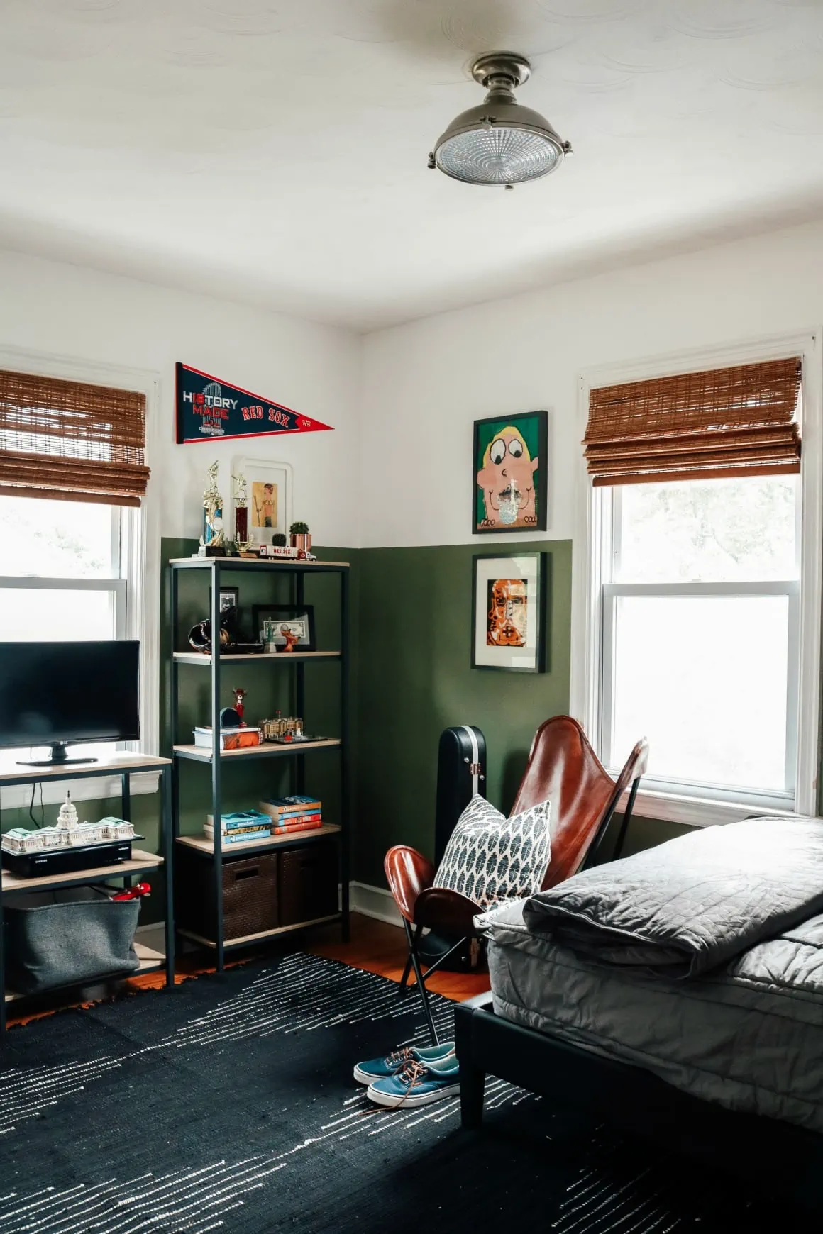 half painted green walls in teenage boys room 