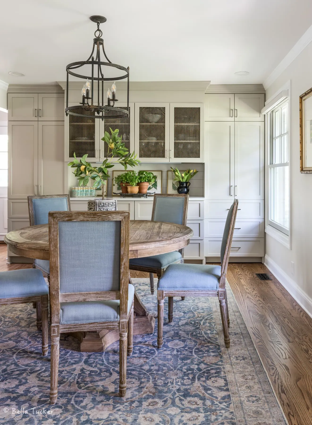 built in cabinet in dining room with hidden pantry 