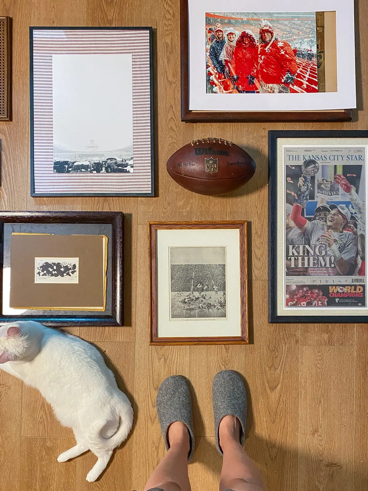 planning out the Kansas City chiefs wall decor gallery wall in the man cave