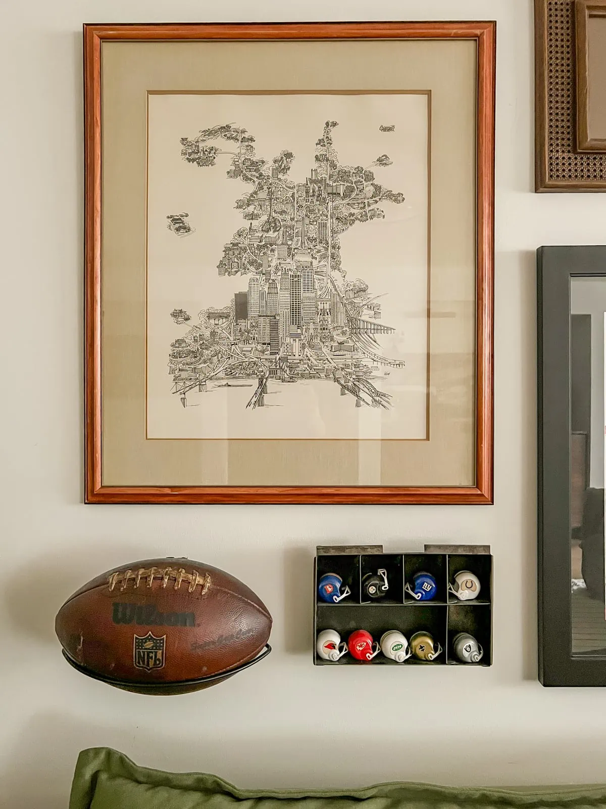 sports memorabilia using vintage football on gallery wall 